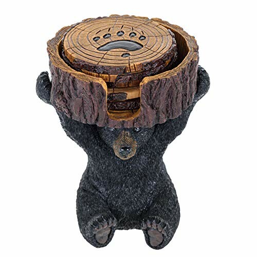 Bear figurine holding a wooden stump with holes.